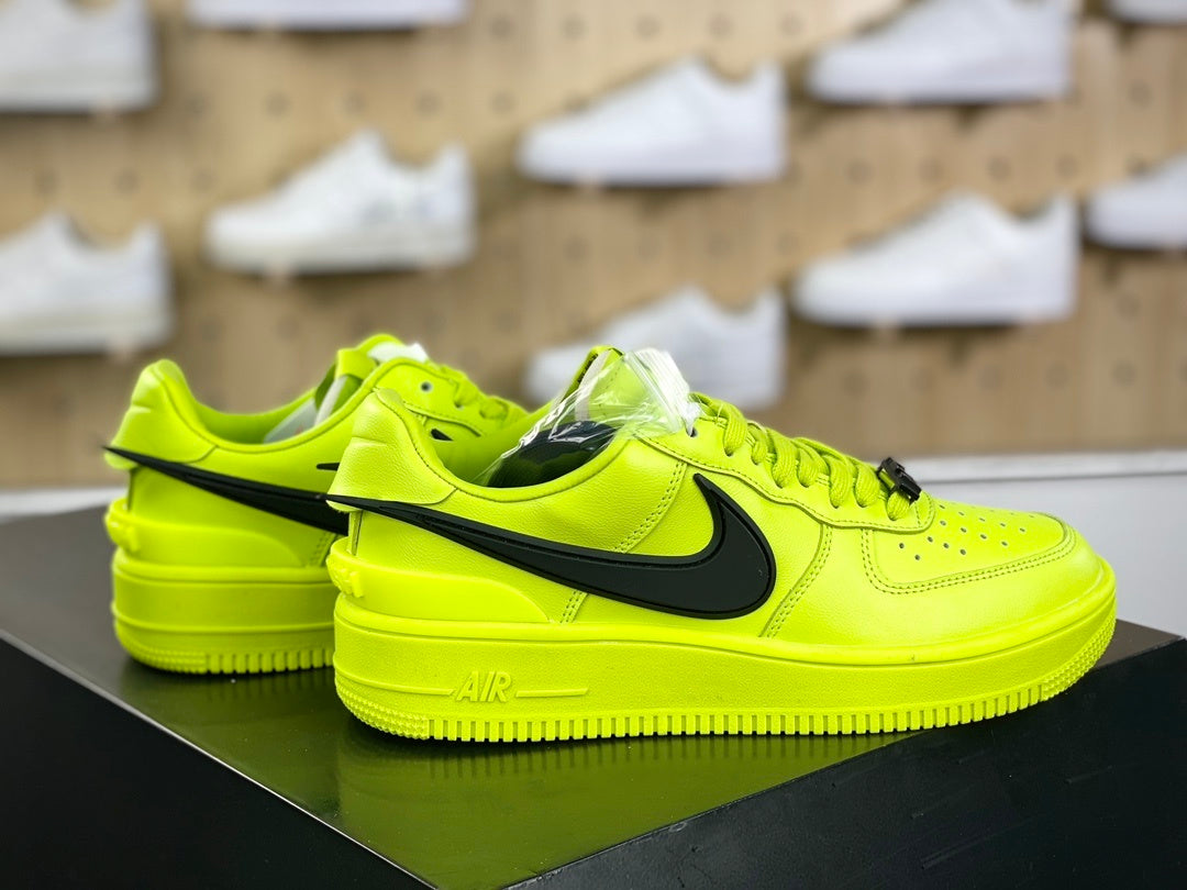Neon yellow and black low-top sneakers with extended side detail, view 3