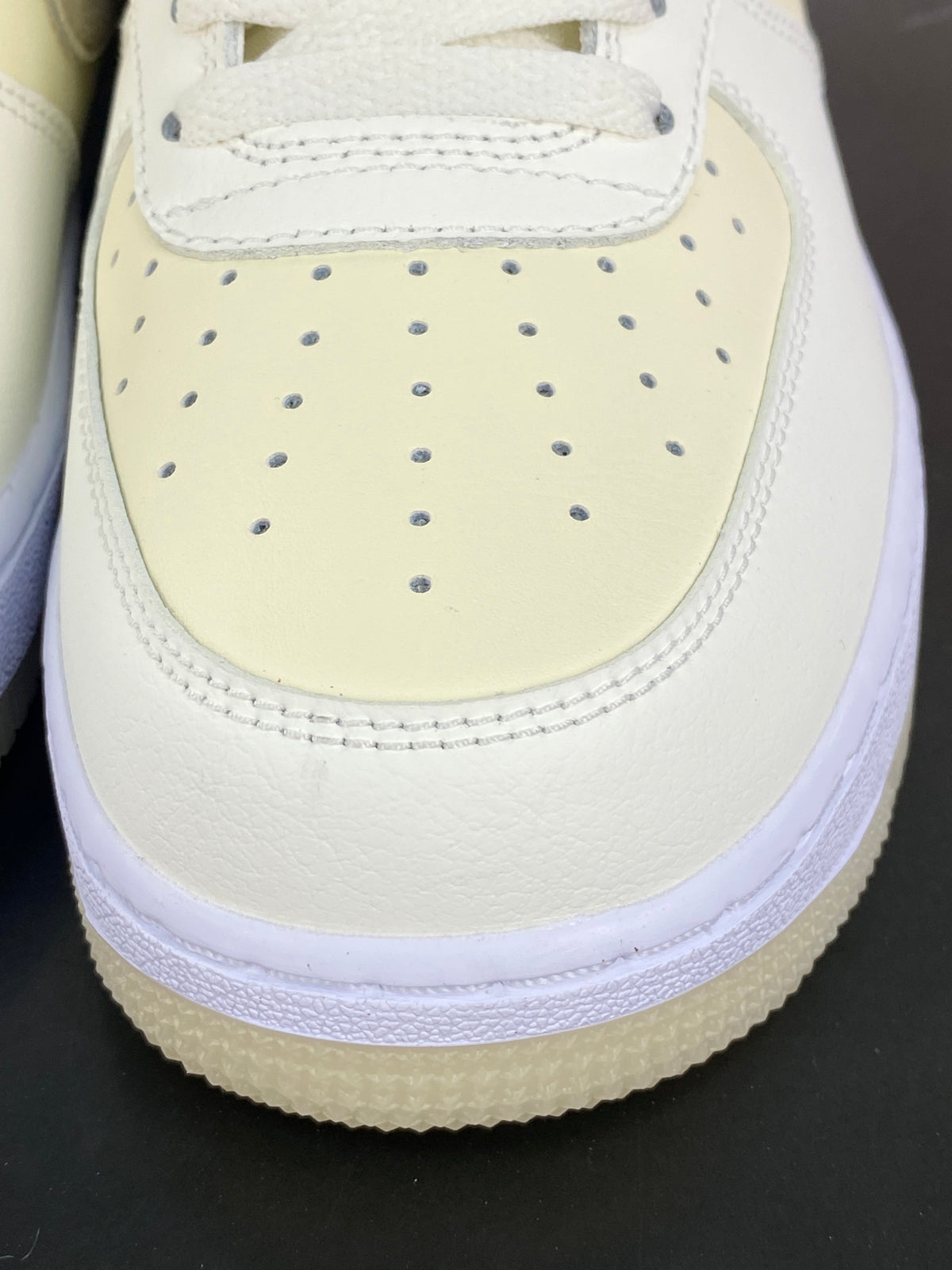 Cream and khaki low-top sneakers with white midsole